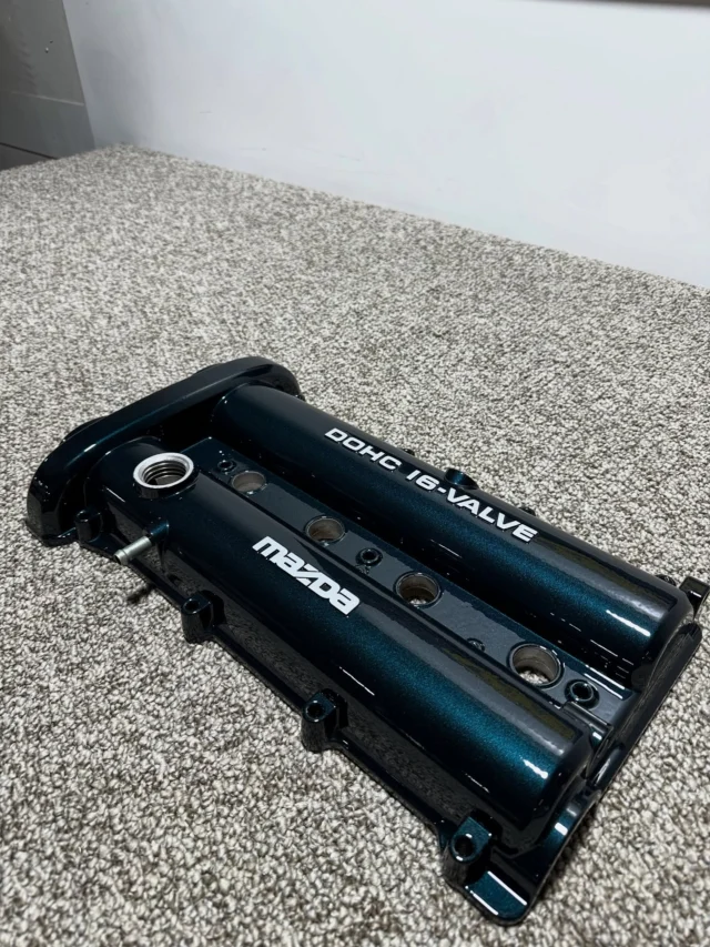 Miata valve cover powder coated in Misty Aquarius with a glossy clear top coat & silver lettering wiped off for a flashy two-tone appearance. 
Misty Aquarius / PMB-4245 / @prismaticpowders 
#melrose #melrosemetalfinishing #melrosepowdercoating #powdercoat #powdercoating #prismaticpowders #miata #mazdamiata #mistyaquarius #valvecover #valvecoverpowdercoat